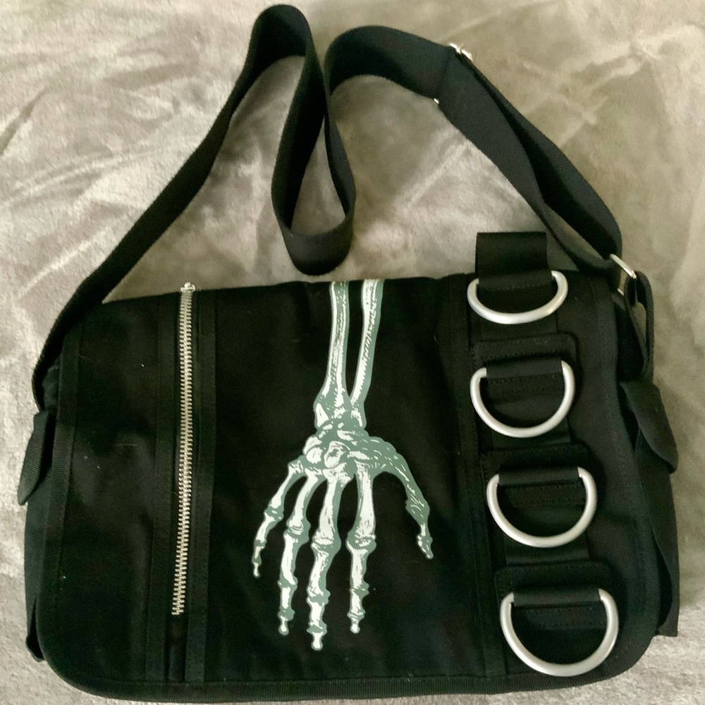 Skeleton hand messenger bag